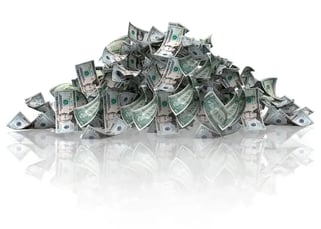 Pile of dollars - isolated over a white background